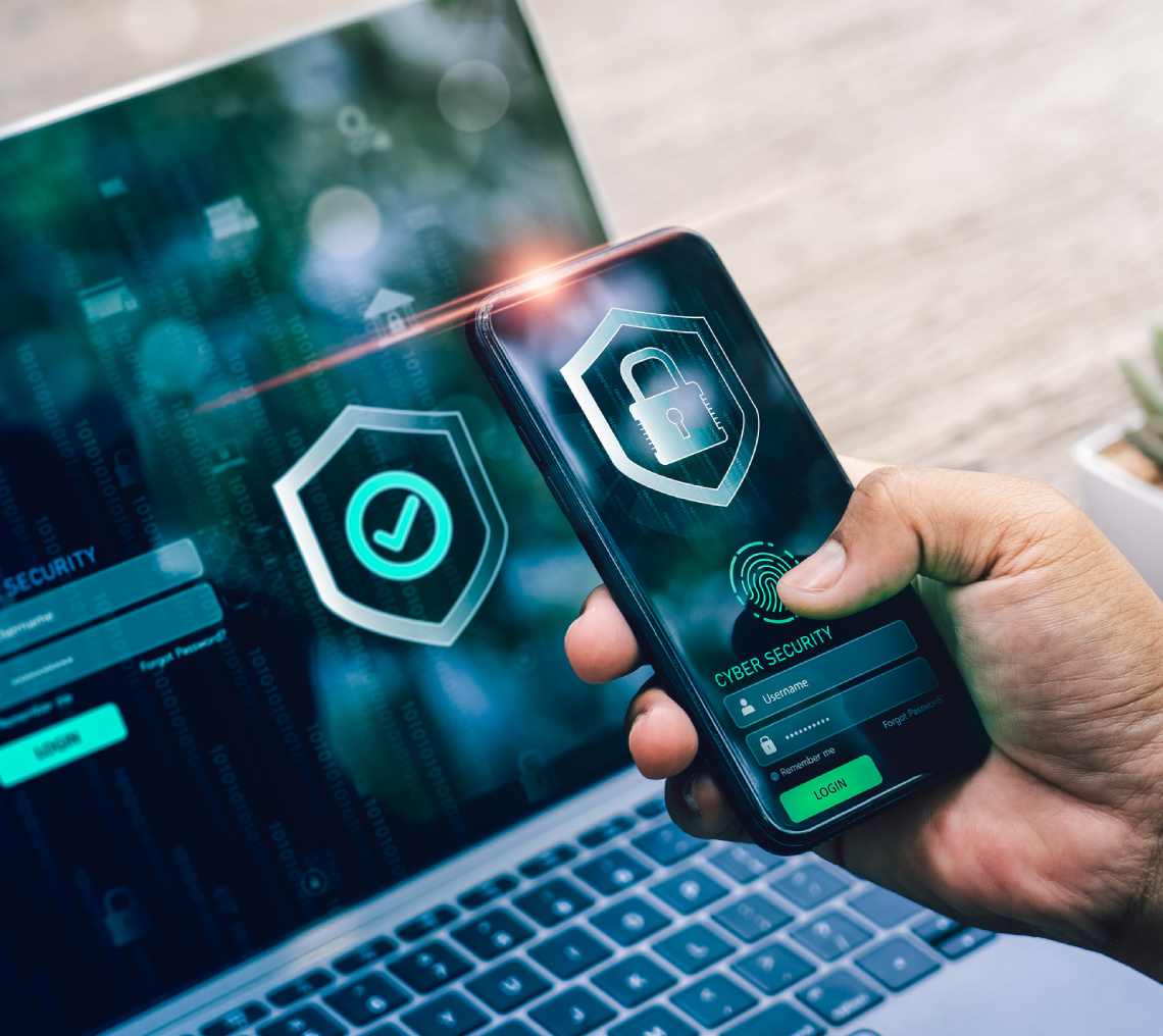 Smartphone displaying cybersecurity features on laptop.